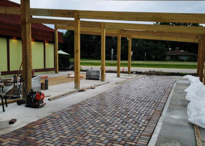 Restaurant new outside patio with veranda, pavers and concrete serving area.
